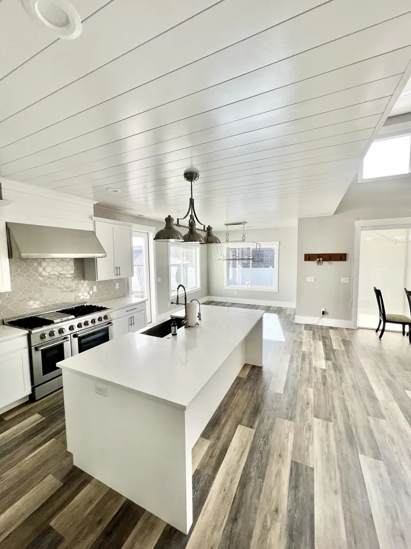 White shiplap ceiling in a finished kitchen
